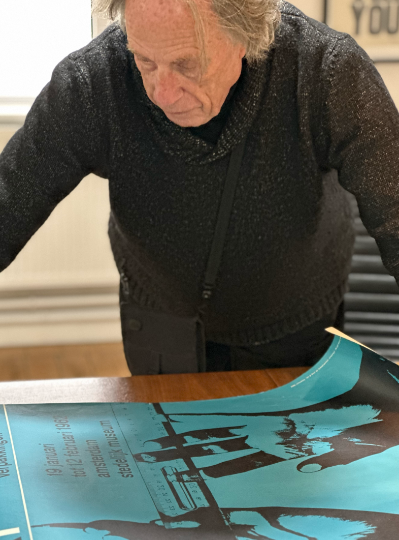 David working on a large print poster